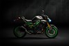 Profile angle of a motorcycle staged in a dark studio.